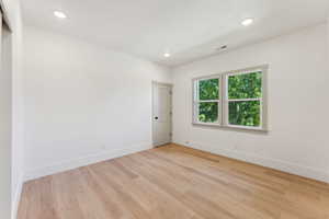 Empty room featuring light hardwood / wood-style flooring