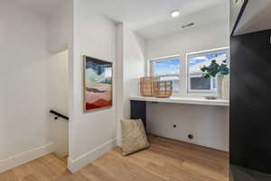 Bathroom with hardwood / wood-style floors