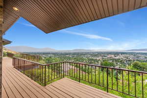 Wooden terrace featuring a mountain view