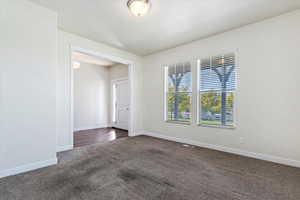 Unfurnished room with carpet flooring