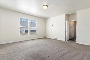 View of carpeted spare room