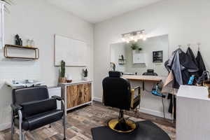 Office space with dark wood-type flooring