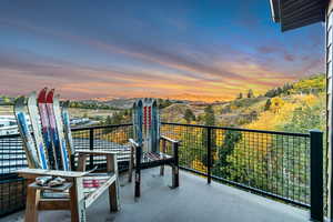 Balcony at dusk with a mountain view