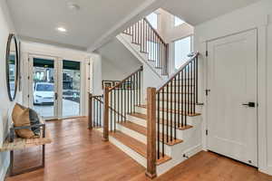 Interior space with hardwood / wood-style floors, french doors, and a healthy amount of sunlight