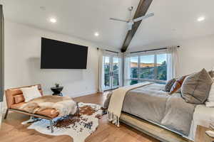 Bedroom with beamed ceiling, light hardwood / wood-style floors, ceiling fan, and access to exterior