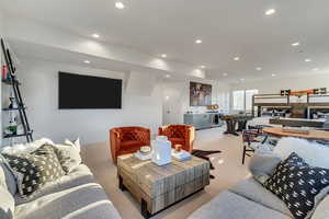 Carpeted living room with sink