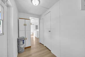 Hallway featuring light hardwood / wood-style floors