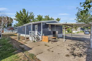 View of front of house with a carport