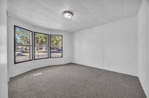 Empty room featuring carpet flooring