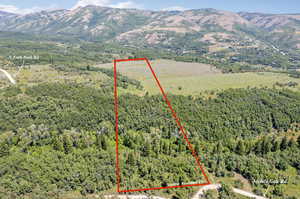 Birds eye view of property with a mountain view