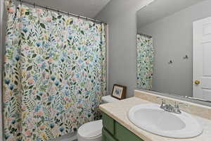 Bathroom with toilet and vanity