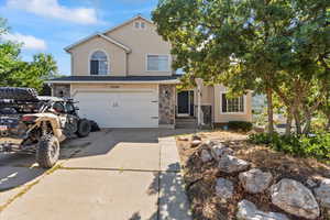 View of front of property featuring a garage