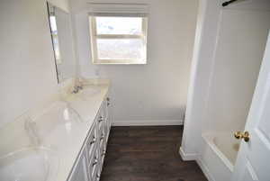 Bathroom featuring hardwood / wood-style floors and vanity