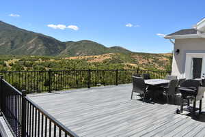 Deck featuring a mountain view and a grill