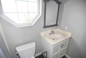 Bathroom featuring vanity and toilet