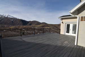 Deck with a mountain view and french doors