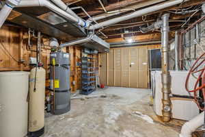 Basement featuring secured water heater