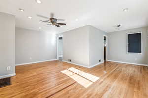 Spare room featuring light hardwood / wood-style floors and ceiling fan