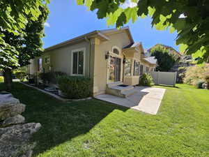 View of home's exterior with a lawn