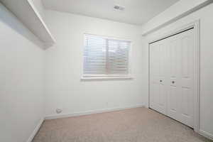 Unfurnished bedroom with a closet