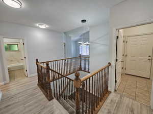 Corridor with light tile patterned floors