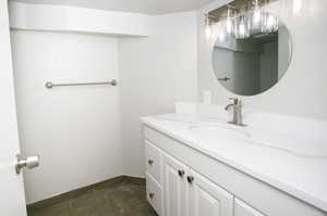 Bathroom featuring tile patterned flooring and vanity