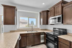 Kitchen with new dishwasher and microwave