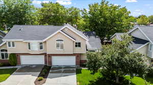 View of front facade featuring a garage