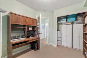 View of carpeted home office