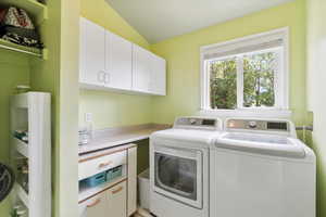 Clothes washing area with independent washer and dryer and cabinets