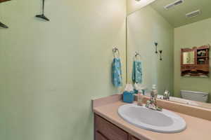 Bathroom with vanity and toilet