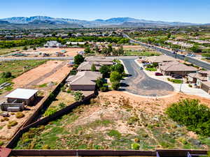 Birds eye view of property with a mountain view