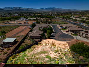 Birds eye view of property with a mountain view