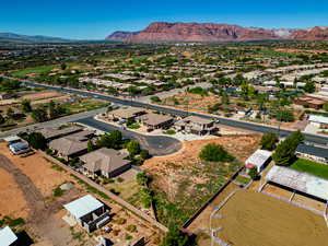 Birds eye view of property with a mountain view