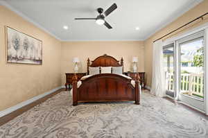 Bedroom with ceiling fan, access to exterior, light hardwood / wood-style floors, and ornamental molding