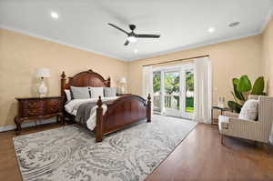 PRIMARY Bedroom featuring ceiling fan, ornamental molding, access to outside, and wood-type flooring