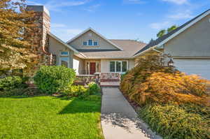 View of front facade with a garage and a front yard