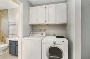 Laundry room with washer and clothes dryer