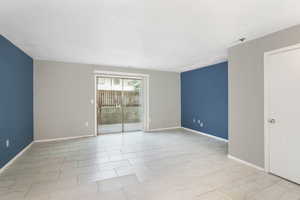 Empty room featuring light tile patterned flooring