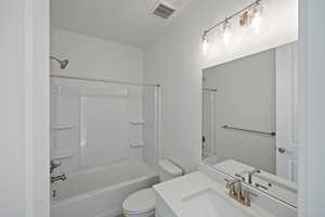 Full bathroom with vanity, shower / bathtub combination, and toilet