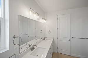 Bathroom featuring tile patterned floors and vanity