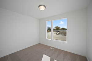 View of carpeted spare room