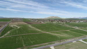 Birds eye view of property featuring a rural view and a mountain view