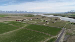 Birds eye view of property with a rural view and a water and mountain view