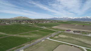 Aerial view featuring a rural view and a mountain view