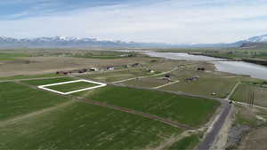 Bird's eye view with a rural view and a water and mountain view