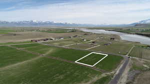 Birds eye view of property featuring a rural view and a water and mountain view