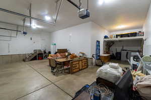 Garage featuring a garage door opener