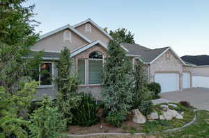 View of front facade featuring a garage