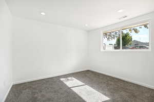 Unfurnished room with carpet floors